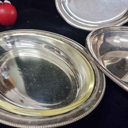 237 - A pair of antique silverplated lidded tureens, one with glass liner.