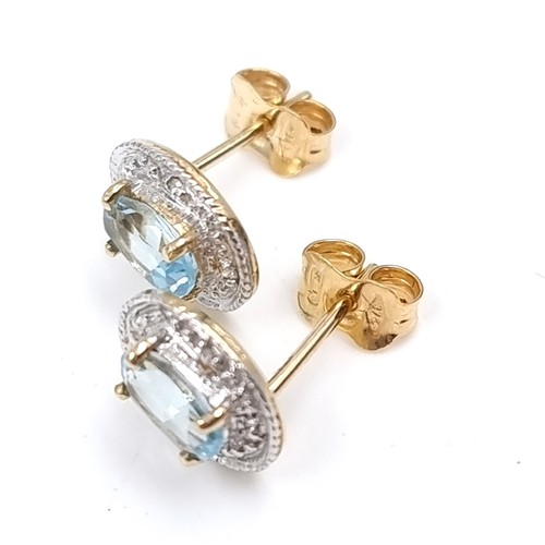 2 - Star Lot : An attractive pair of nine carat gold blue topaz and diamond set stud earrings. Weight - ... 