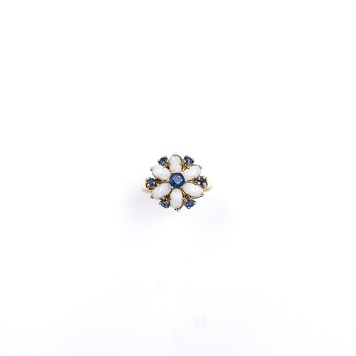 8 - Star Lot : A very attractive daisy style nine carat gold ring set with sapphire & opal surround. Siz... 