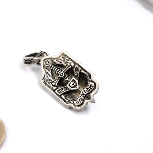 46 - A Sterling Silver Crowned Lion pendant with suspension ring stating Royal blood. Back marked 'USA 92... 