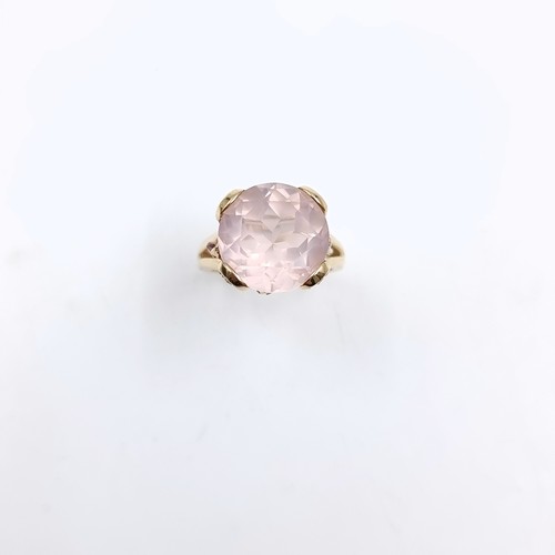 9 - Star lot : A very large pink topaz  ring set in nine carat gold with claw mount. Size - O 1/2. Weigh... 