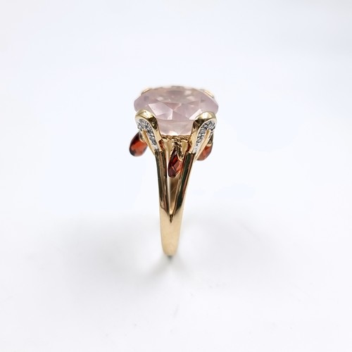 9 - Star lot : A very large pink topaz  ring set in nine carat gold with claw mount. Size - O 1/2. Weigh... 