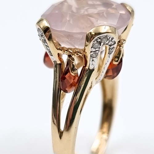 9 - Star lot : A very large pink topaz  ring set in nine carat gold with claw mount. Size - O 1/2. Weigh... 