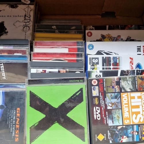 412 - A crate of music CDs featuring artists such as Genesis and Ed Sheeran, along with 7 PlayStation 2 vi... 