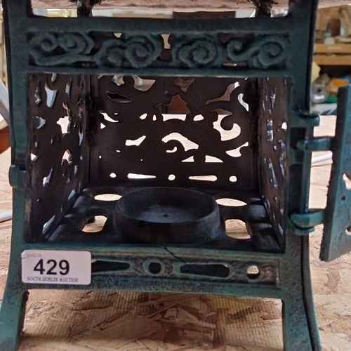 429 - Cast iron pagoda-style lantern with intricate pierced detailing. Hinged door with interior candle ho... 