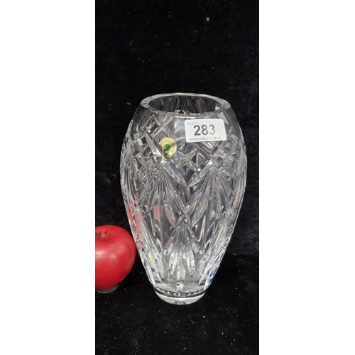 283 - A striking tall Waterford Crystal vase in excellent condition, retaining original sticker and acid m... 