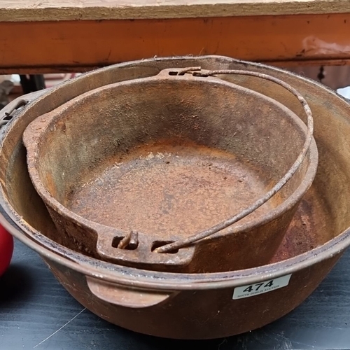 474 - Antique very very heavy cast iron Dutch oven with lid, accompanied by a smaller cast iron pot with a... 