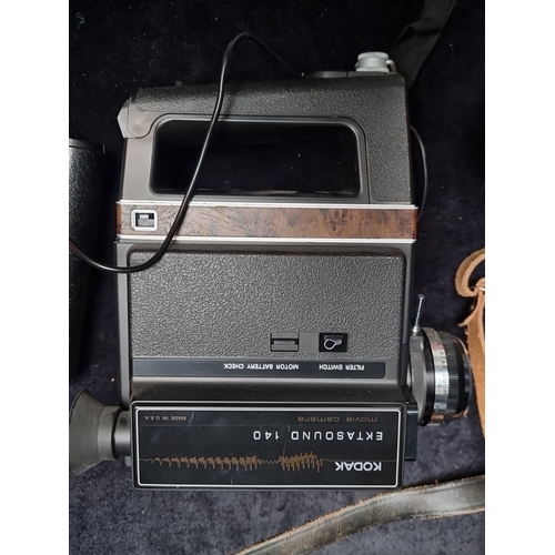 488 - Vintage Kodak Ektasound 140 movie camera with original carrying case, strap, and accessories. Featur... 