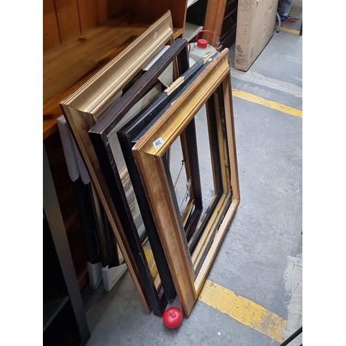 492 - Assorted lot of vintage decorative picture frames, featuring gilded and black wood designs.