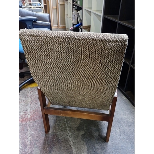 633 - Mid-century modern lounge chair with solid wood frame and textured fabric upholstery. Features a sle... 