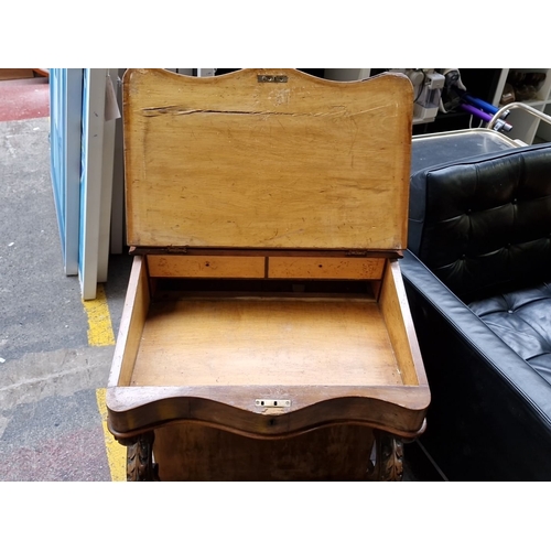 639 - Star Lot : Victorian walnut Davenport desk, 19th century, features a tooled leather writing surface,... 