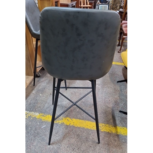 680 - Pair of modern bar stools with black metal legs and upholstered grey seats.