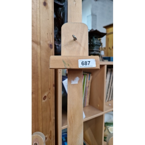 687 - A good free standing Adjustable height wooden easel.