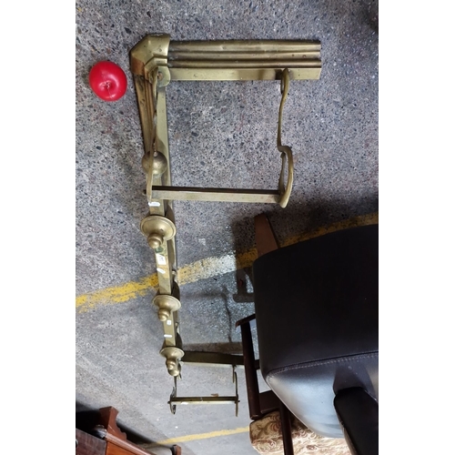 692 - Victorian brass fireplace fender features integrated tool rests, ornate detailing with turned finial... 