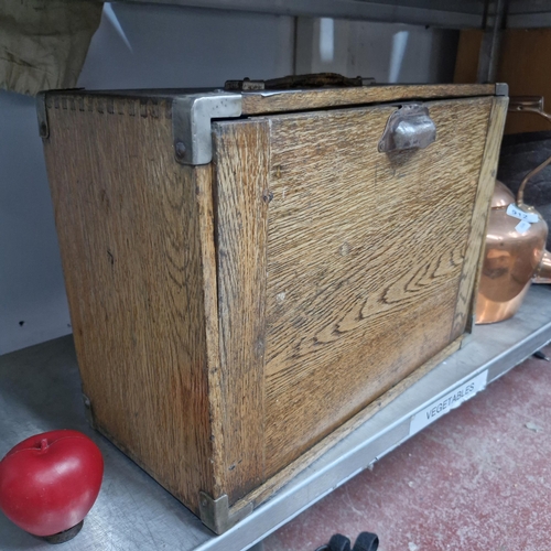 911 - Star Lot : A 1920's oak collectors chest featuring seven drawers and turned handles.