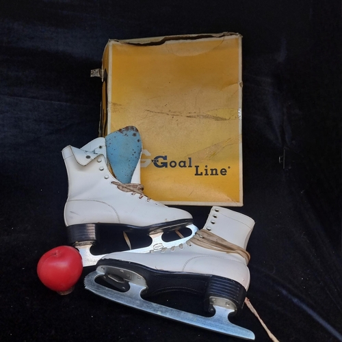 1387 - A pair of 1970's American made ice skates with Canadian steel blades and bell pom poms. In original ... 