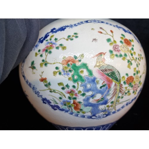 147 - Star Lot : A very large antique Chinese vase in a Famile Rose pattern. Wonderful hand painted design... 