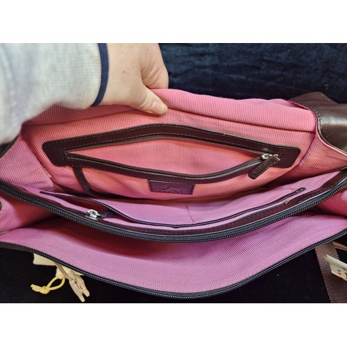 163 - A quality Radley soft chocolate brown leather shoulder bag with pink lining. Includes original dust ... 