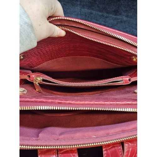 185 - A stylish ladies red leather Parfois red leather backpack.