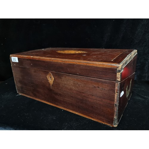 252 - A large Victorian mahogany writing slope, boasting brass handles to each side along with marvelous m... 