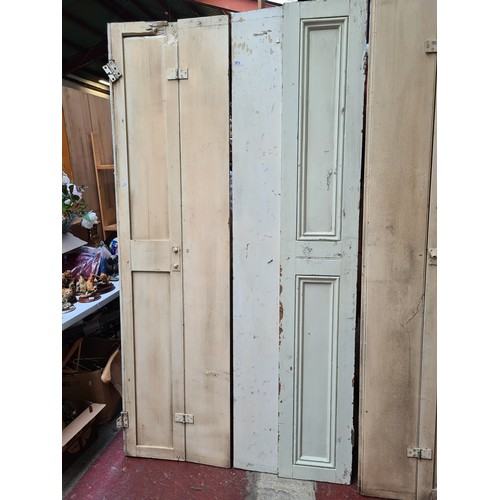 373 - Two bi fold pairs of Georgian window shutters. MM: 55cm x 204cm.