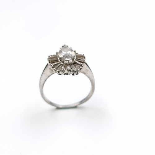 560 - A dazzling marquise cut cubic zirconia centre stone surrounded by tapered baguette cut cubic zirconi... 