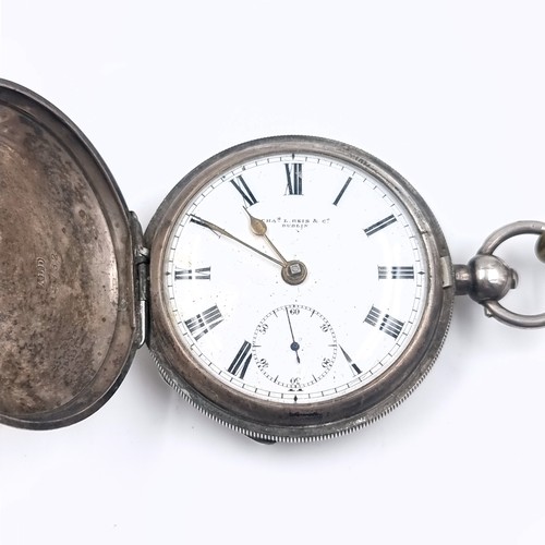 15 - A sterling silver hallmarked pocket watch with roman numeral dial and subsidiary second hand. Maker ... 