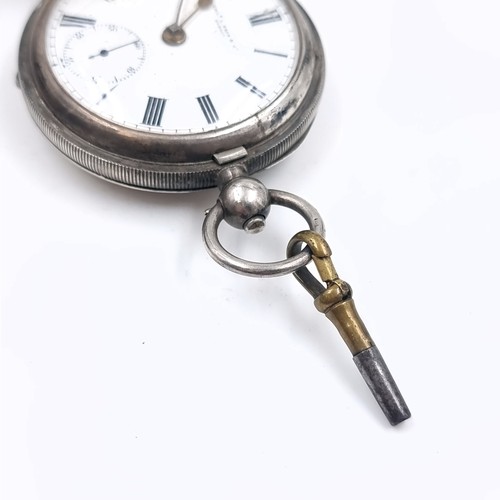 15 - A sterling silver hallmarked pocket watch with roman numeral dial and subsidiary second hand. Maker ... 