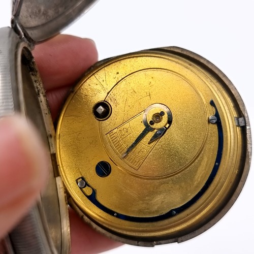 15 - A sterling silver hallmarked pocket watch with roman numeral dial and subsidiary second hand. Maker ... 