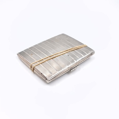 527 - A sterling silver cigarette/business card holder hallmarked Birmingham with initialled engine turned... 