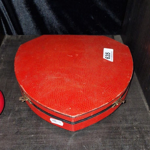 635 - Antique heart-shaped vanity set in red leather case with fitted interior, including mirror and groom... 