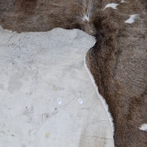 662 - Star Lot : Large natural large  cowhide rug with rich brown and white markings. Soft texture with hi... 