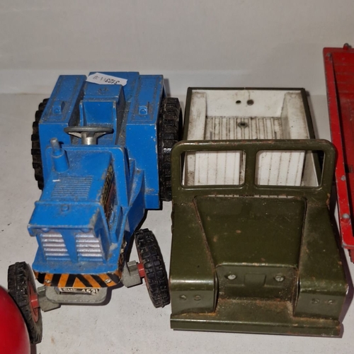 667 - Vintage diecast farm and utility vehicle lot, including a tractor, jeep, tipping trailers, and truck... 