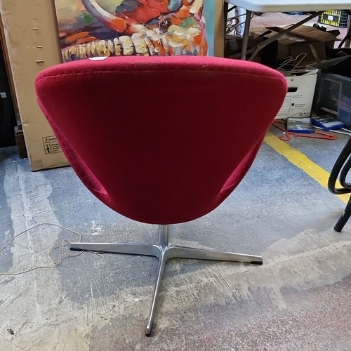 691 - Star Lot : Arne Jacobsen-style Swan Chair, upholstered in rich red fabric with a swivel aluminum bas... 