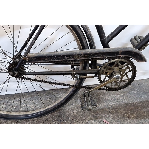 1154 - A Vintage Raleigh bicycle, early to mid-20th century. Features a step-through frame, full fenders, c... 