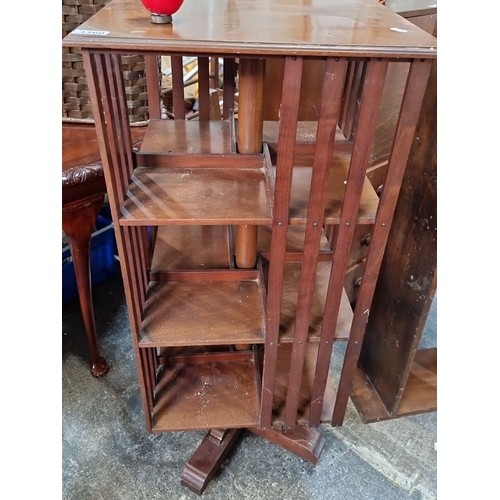 1160 - Star lot :An Edwardian mahogany revolving bookcase, early 20th century. Features tiered shelving wit... 