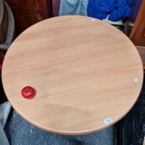 1166 - A Round bistro table with a wood-effect laminate top and chrome pedestal base.