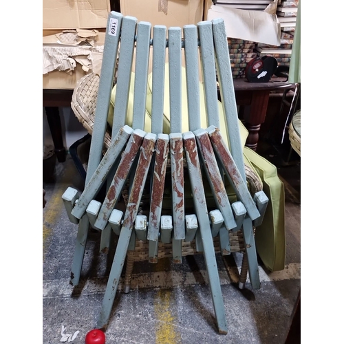 1169 - A Rustic folding wooden slat chair in distressed blue paint with a unique folding design.