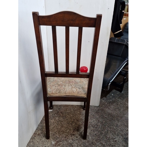 1180 - Early 20th-century wooden dining chair with turned legs, pierced crest rail, and floral upholstered ... 