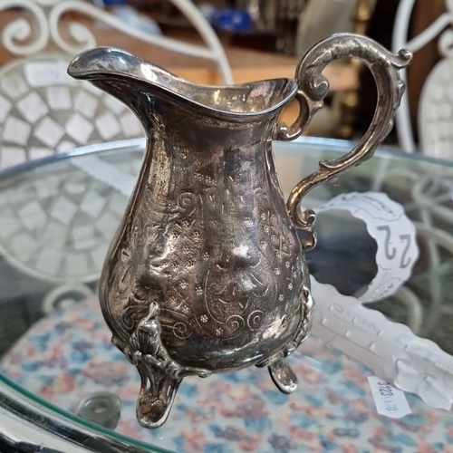 1183 - Large lot of silver-plated tea and coffee ware, including ornate teapots, creamers, trays, and a dec... 