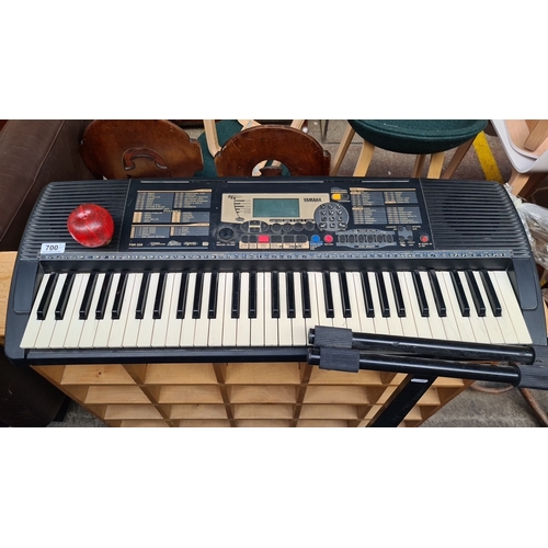 700 - Yamaha PSR-225 electronic keyboard with adjustable stand. Features multiple tones, rhythms, and digi... 