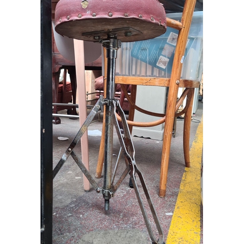 708 - Vintage adjustable drum stool with red leather seat and rivet detailing. Chrome tripod base.