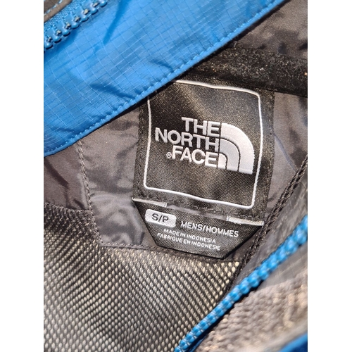 710 - North Face outdoor apparel lot, including waterproof jackets, leggings, and a pair of Futurelight hi... 