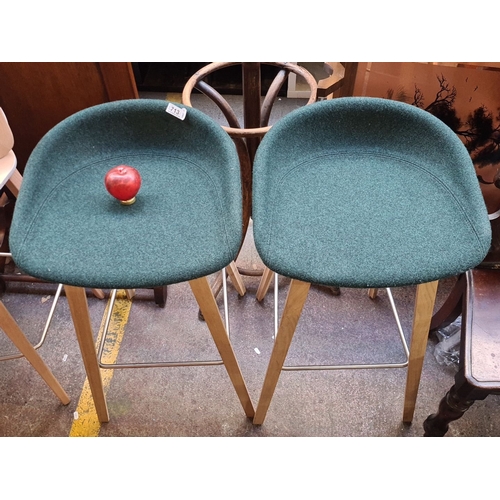 713 - Star Lot: A fabulous pair of Designville contemporary bar stools feature green upholstered seats, oa... 