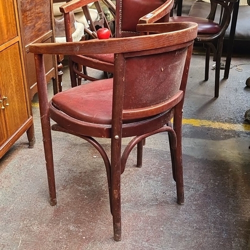 721 - Pair of vintage bentwood and leather armchairs from the early to mid-20th century. The chairs have c... 