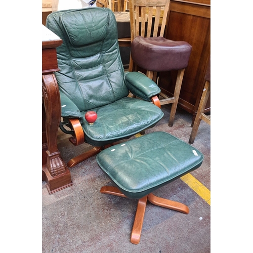 728 - Vintage green leather swivel lounge chair with matching ottoman, featuring a wooden frame, padded ar... 