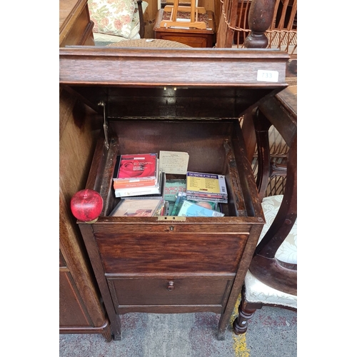 733 - Vintage wooden music cabinet with lift-top storage and lower drawer for additional storage. Filled w... 