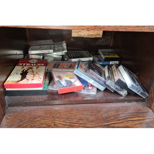 733 - Vintage wooden music cabinet with lift-top storage and lower drawer for additional storage. Filled w... 