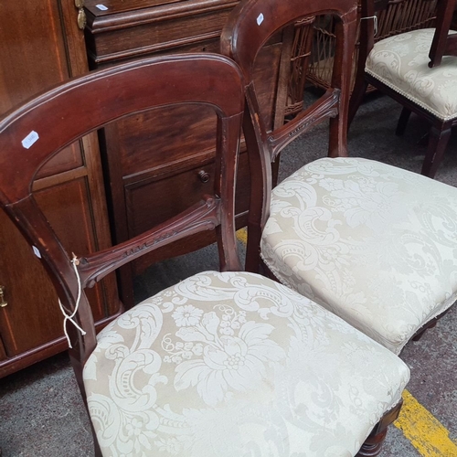 734 - Pair of 19th-century Victorian balloon-back chairs in rich mahogany, featuring elegant carved detail... 