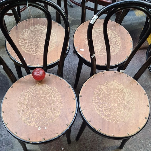 737 - Set of four vintage bentwood café chairs with decorative embossed seats and elegant curved black fra... 